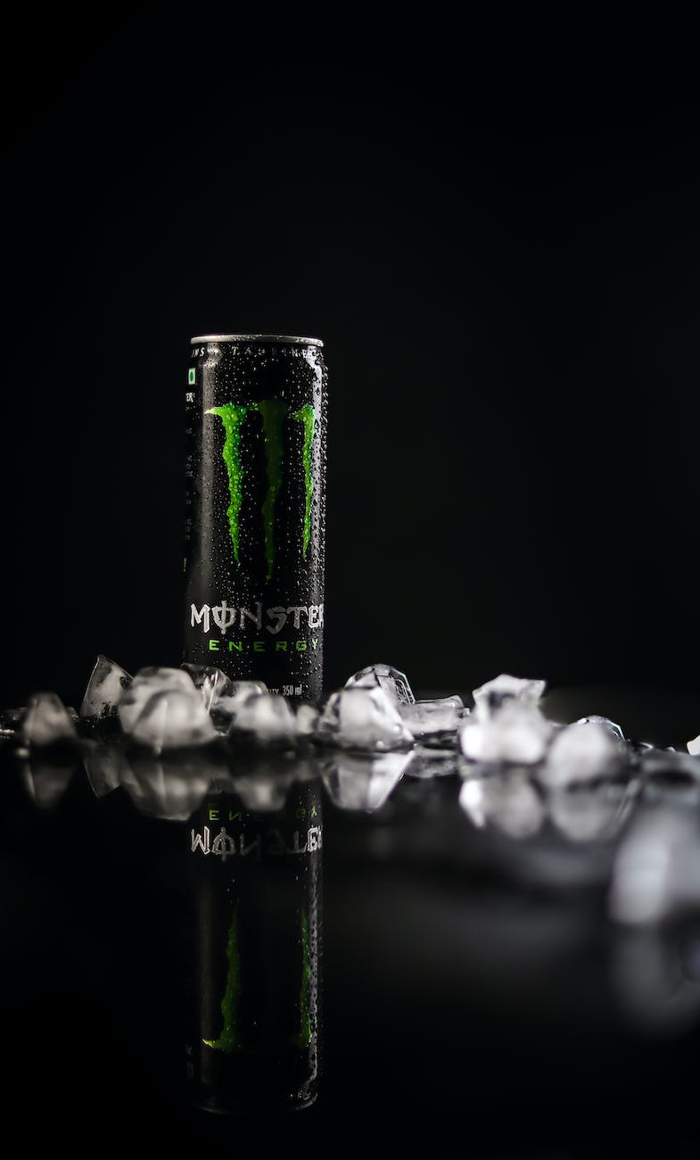 monster energy tin can on black surface